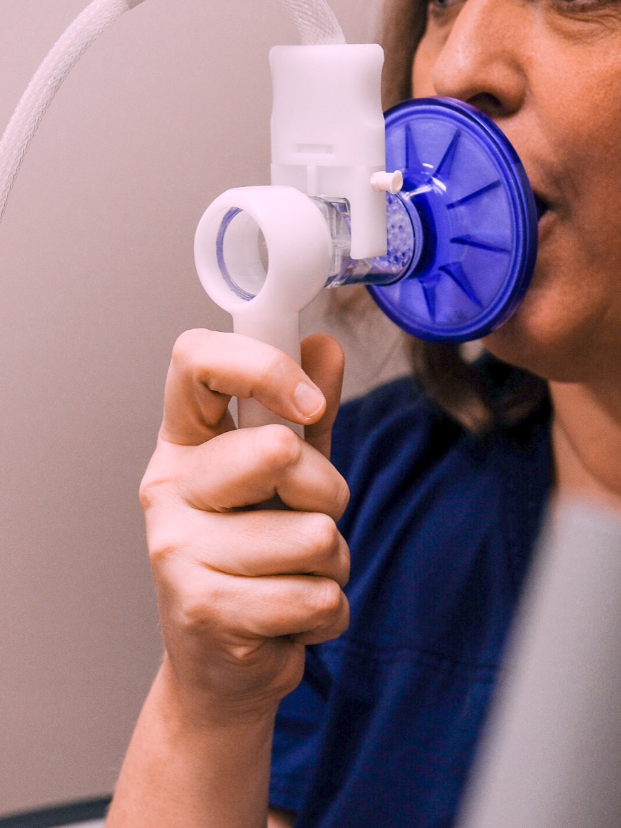 One of our staff demonstrating pulmonary testing equipment