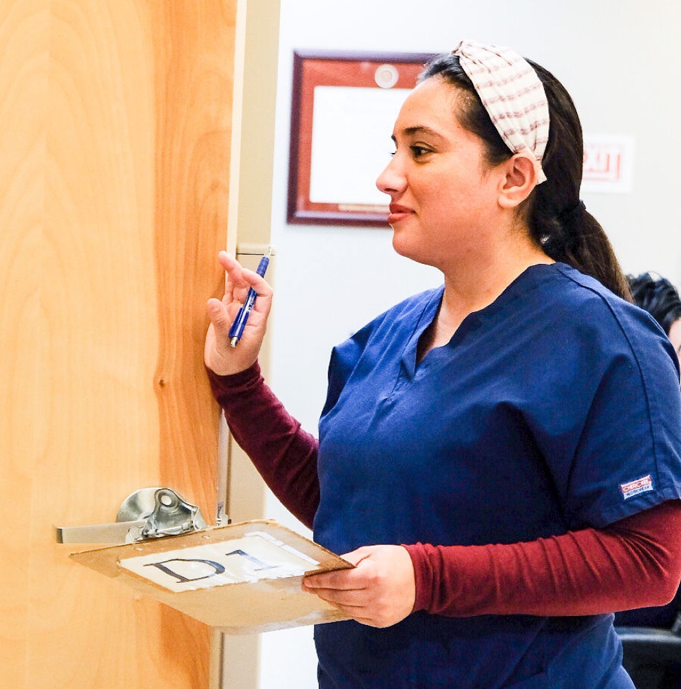One of our staff calling in the next patient